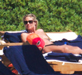Heidi Klum sunbathing topless in Sardinia (8/2011)
