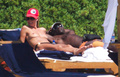 Heidi Klum sunbathing topless in Sardinia (8/2011)