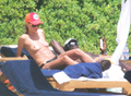 Heidi Klum sunbathing topless in Sardinia (8/2011)