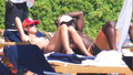 Heidi Klum sunbathing topless in Sardinia (8/2011)