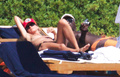 Heidi Klum sunbathing topless in Sardinia (8/2011)