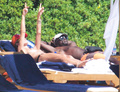 Heidi Klum sunbathing topless in Sardinia (8/2011)