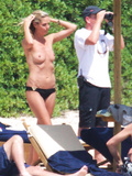 Heidi Klum sunbathing topless in Sardinia (8/2011)