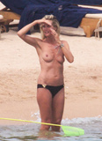 Heidi Klum sunbathing topless in Sardinia (8/2011)
