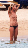 Heidi Klum sunbathing topless in Sardinia (8/2011)