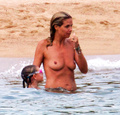 Heidi Klum sunbathing topless in Sardinia (8/2011)