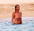 Heidi Klum sunbathing topless in Sardinia (8/2011)