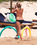 Heidi Klum sunbathing topless in Sardinia (8/2011)