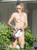 Heidi Klum topless in St. Bart's  (12/2014)
