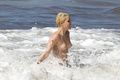 Miley Cyrus topless on Hawaii (01/2015)