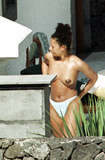 Melanie Brown topless on beach