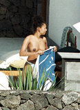 Melanie Brown topless on beach
