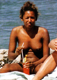 Melanie Brown topless on beach