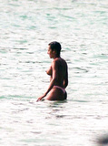 Melanie Brown topless on beach