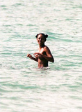 Melanie Brown topless on beach