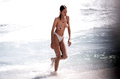 Uma Thurman - topless on the beach in St. Bart's (7/96)