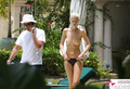 Claudia Schiffer - topless sunbathing (2002)
