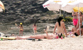 Charlize Theron - sunbathing topless in Brazil (1/2005)
