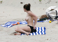 Kelly Brook sunbathing topless in St. Bart’s (1/2008)