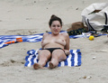 Kelly Brook sunbathing topless in St. Bart’s (1/2008)