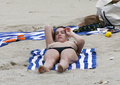 Kelly Brook sunbathing topless in St. Bart’s (1/2008)