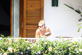 Sienna Miller - topless on balcony (7/2008)