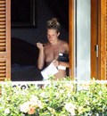 Sienna Miller - topless on balcony (7/2008)