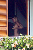 Sienna Miller - topless on balcony (7/2008)