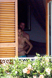 Sienna Miller - topless on balcony (7/2008)