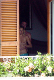 Sienna Miller - topless on balcony (7/2008)