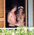 Sienna Miller - topless on balcony (7/2008)