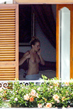 Sienna Miller - topless on balcony (7/2008)