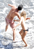 Sienna Miller - topless on the beach in Italy (7/2008)