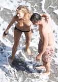 Sienna Miller - topless on the beach in Italy (7/2008)