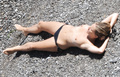 Sienna Miller - topless on the beach in Italy (7/2008)