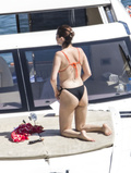 Selena Gomez wearing a bikini on a boat