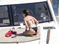 Selena Gomez wearing a bikini on a boat