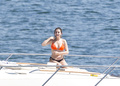 Selena Gomez wearing a bikini on a boat