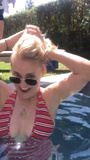 Emily Osment loves showing off her boobs