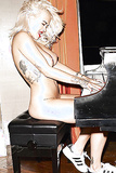 Rita Ora nude at the piano