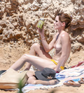 Emma Watson sunbathing topless in Ibiza (6/2022)