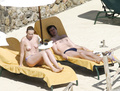 Toni Collette topless sunbathing (12/2005)