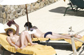 Toni Collette topless sunbathing (12/2005)