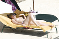 Toni Collette topless sunbathing (12/2005)