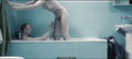 Polish actress Julia Kijowska nude in a bathtub