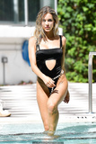 Joy Corrigan in black monokini by a pool in Miami Beach - July 11, 2019
