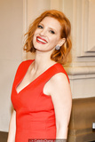 Redhead Jessica Chastain in red dress at red carpet