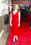 Redhead Jessica Chastain in red dress at red carpet