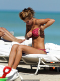 Jesica Cirio areola slip in red bikini on the beach in Miami - October 29, 2012