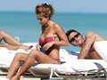 Jesica Cirio areola slip in red bikini on the beach in Miami - October 29, 2012